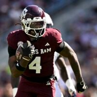 Sep 27, 2025; College Station, Texas, USA; Texas A&M Aggies running back Rueben Owens II (4) runs the ball during the first half against the Auburn Tigers at Kyle Field.