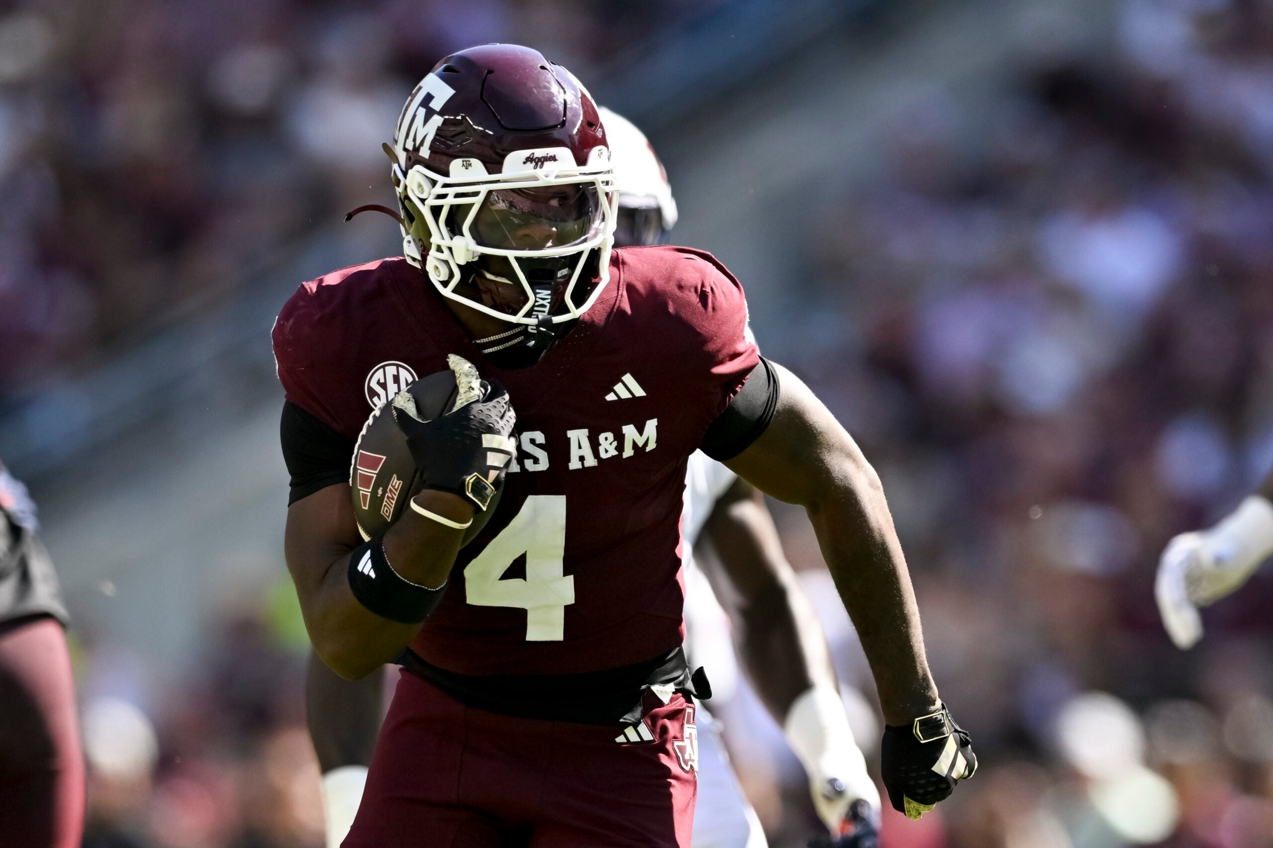 Sep 27, 2025; College Station, Texas, USA; Texas A&M Aggies running back Rueben Owens II (4) runs the ball during the first half against the Auburn Tigers at Kyle Field.