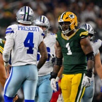 Sep 28, 2025; Arlington, Texas, USA; Green Bay Packers defensive end Micah Parsons (1) stares at Dallas Cowboys quarterback Dak Prescott (4) during the game between the Dallas Cowboys and the Green Bay Packers at AT&T Stadium.