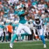 Oct 5, 2025; Charlotte, North Carolina, USA; Miami Dolphins tight end Darren Waller (83) catches the ball as Carolina Panthers cornerback Corey Thornton (31) defends in the first quarter at Bank of America Stadium.