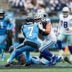 Oct 12, 2025; Charlotte, North Carolina, USA; Carolina Panthers safety Tre'von Moehrig (7) and Dallas Cowboys running back Hunter Luepke (40) battle it at Bank of America Stadium.