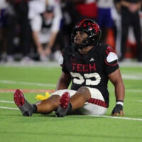 Oct 11, 2025; Lubbock, Texas, USA; Texas Tech Red Raiders defensive tackle AJ Holmes Jr. (33) reacts after a play against the Kansas Jayhawks in the second half at Jones AT&T Stadium.