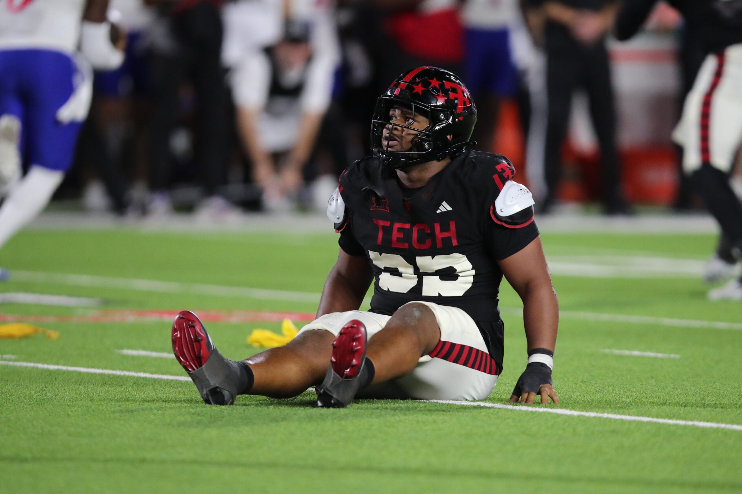Oct 11, 2025; Lubbock, Texas, USA; Texas Tech Red Raiders defensive tackle AJ Holmes Jr. (33) reacts after a play against the Kansas Jayhawks in the second half at Jones AT&T Stadium.