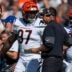 Cincinnati Bengals defensive end Shemar Stewart (97) talks with defensive coordinator Al Golden in the fourth quarter of the NFL Week 1 game between the Cleveland Browns and the Cincinnati Bengals at Huntington Bank Field in Cleveland on Sunday, Sept. 7, 2025. The Bengals begin the season with a 17-16 win over the Browns.