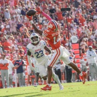 Oct 18, 2025; Clemson, South Carolina, USA; Clemson Tigers wide receiver Bryant Wesco Jr. (12) nearly catches a pass near Southern Methodist Mustangs safety Isaiah Nwokobia (23) during the second quarter at Memorial Stadium.