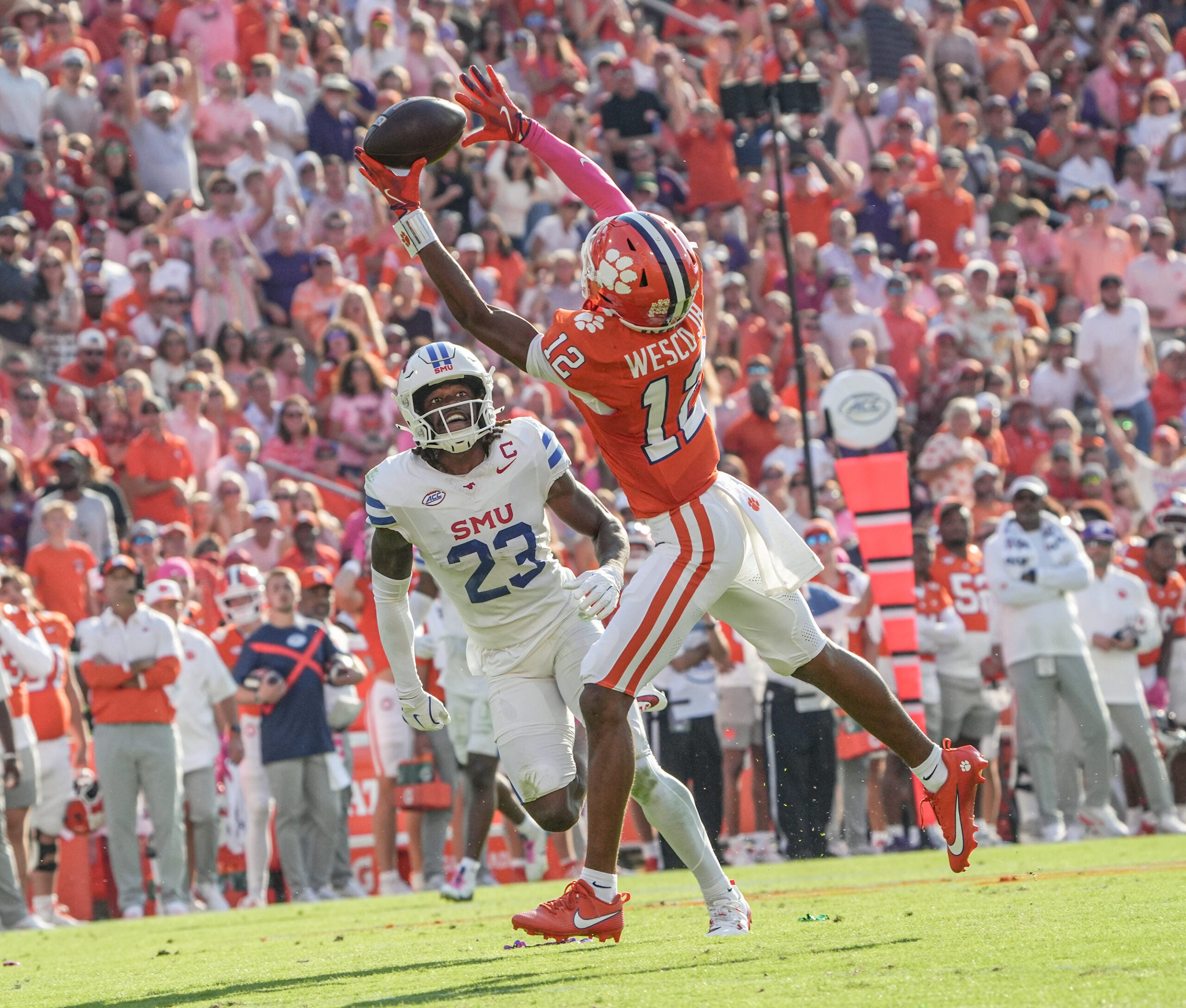 Oct 18, 2025; Clemson, South Carolina, USA; Clemson Tigers wide receiver Bryant Wesco Jr. (12) nearly catches a pass near Southern Methodist Mustangs safety Isaiah Nwokobia (23) during the second quarter at Memorial Stadium.