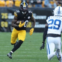 Nov 2, 2025; Pittsburgh, Pennsylvania, USA; Pittsburgh Steelers running back Kaleb Johnson (20) runs the ball against Indianapolis Colts cornerback Mekhi Blackmon (29) during the third quarter at Acrisure Stadium.