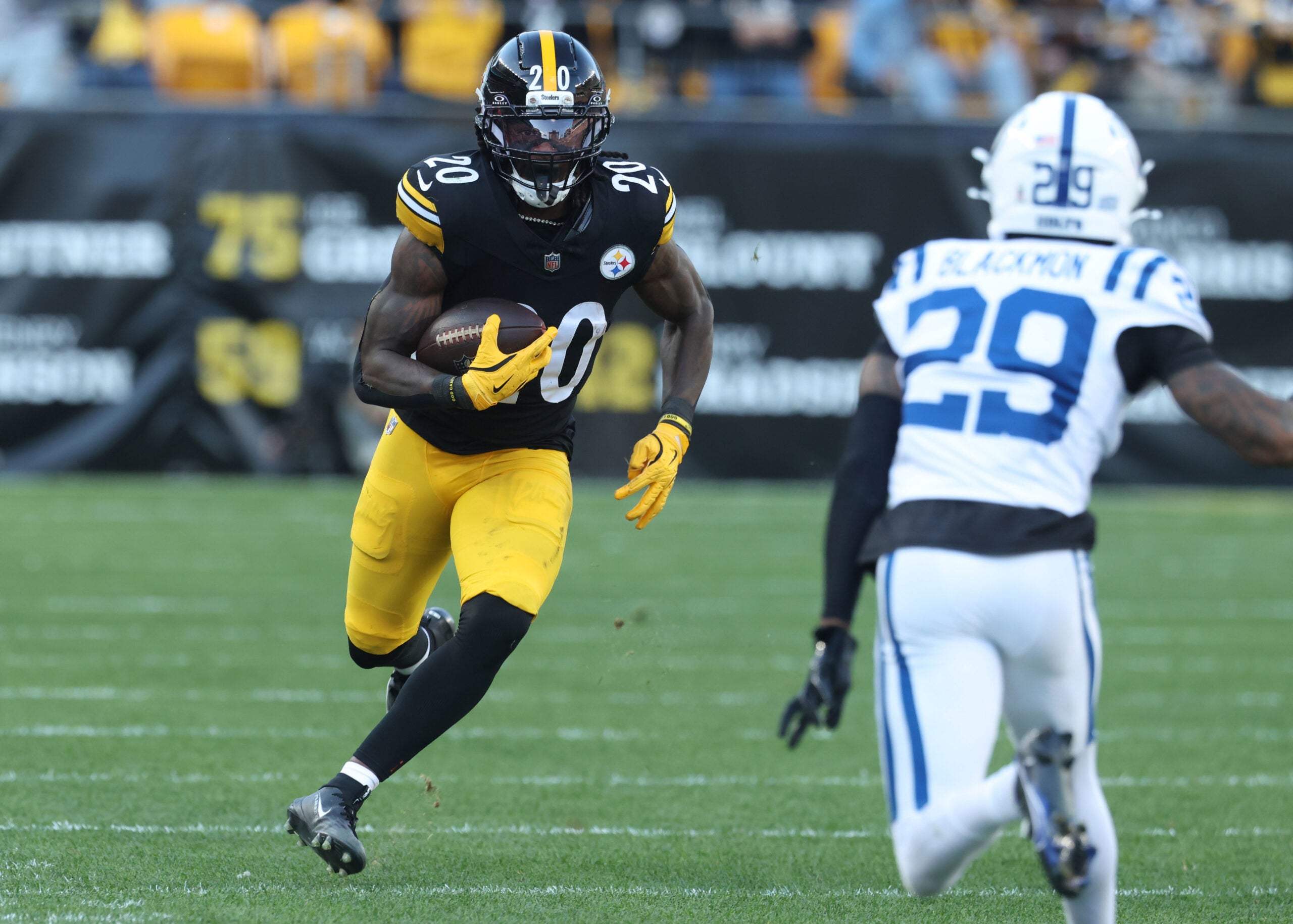 Nov 2, 2025; Pittsburgh, Pennsylvania, USA; Pittsburgh Steelers running back Kaleb Johnson (20) runs the ball against Indianapolis Colts cornerback Mekhi Blackmon (29) during the third quarter at Acrisure Stadium.