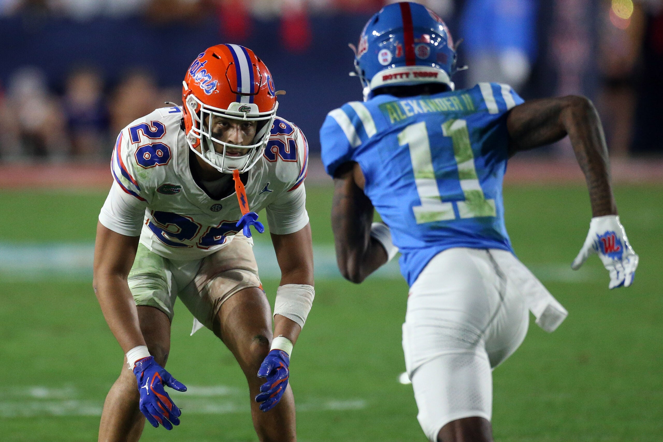 Nov 15, 2025; Oxford, Mississippi, USA; Florida Gators defensive back Devin Moore (28) defends in coverage Mississippi Rebels wide receiver Deuce Alexander (11) during the third quarter at Vaught-Hemingway Stadium.