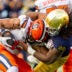 Nov 22, 2025; South Bend, Indiana, USA; Notre Dame Fighting Irish defensive lineman Junior Tuihalamaka (44) hits Syracuse Orange running back Will Nixon (24) during the first half at Notre Dame Stadium.