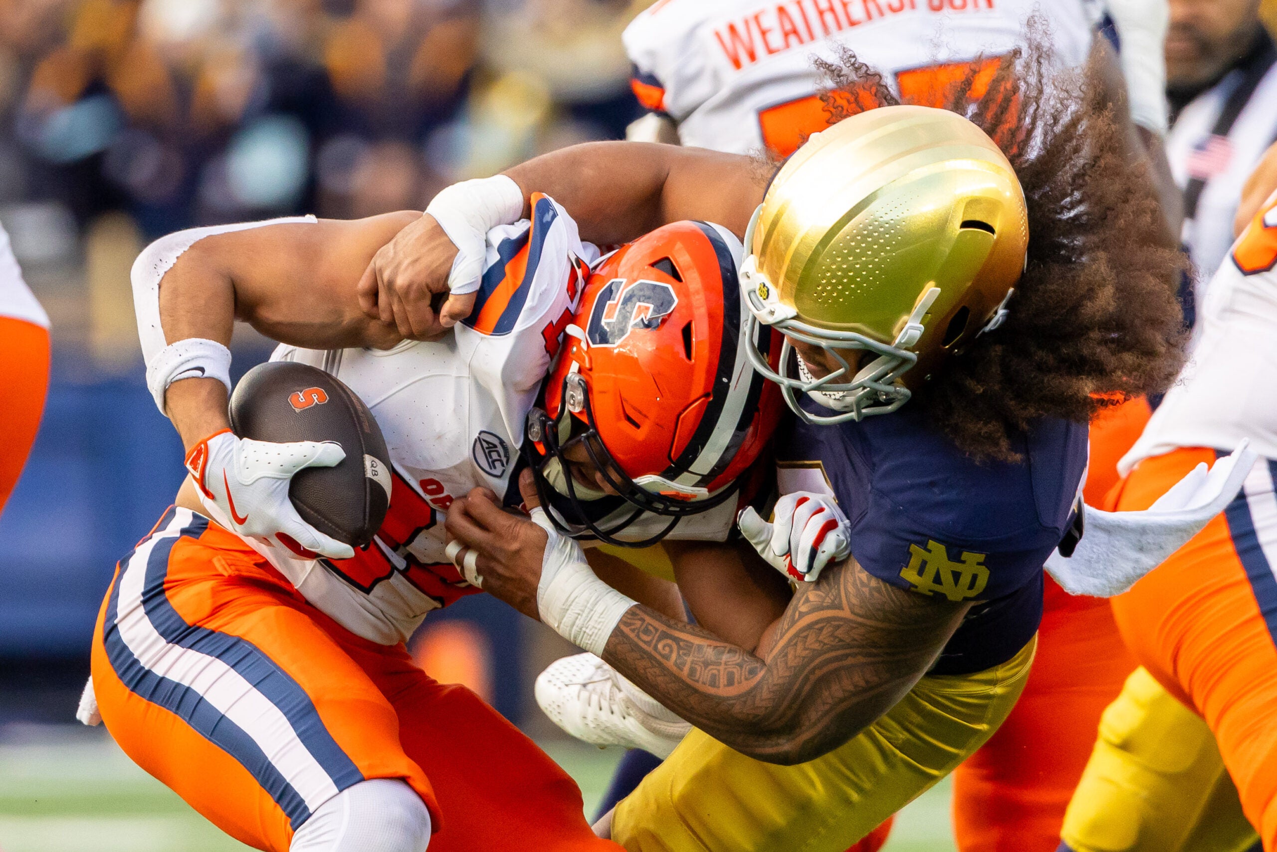 Nov 22, 2025; South Bend, Indiana, USA; Notre Dame Fighting Irish defensive lineman Junior Tuihalamaka (44) hits Syracuse Orange running back Will Nixon (24) during the first half at Notre Dame Stadium.