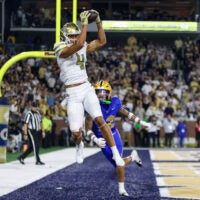 Nov 22, 2025; Atlanta, Georgia, USA; Georgia Tech Yellow Jackets wide receiver Isiah Canion (4) catches a touchdown pass against the Pittsburgh Panthers in the fourth quarter at Bobby Dodd Stadium at Hyundai Field.