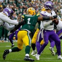 Green Bay Packers defensive end Micah Parsons (1) sacks Minnesota Vikings quarterback J.J. McCarthy (9) on Sunday, November 23, 2025, at Lambeau Field in Green Bay, Wis. The Packers won the game, 23-6.