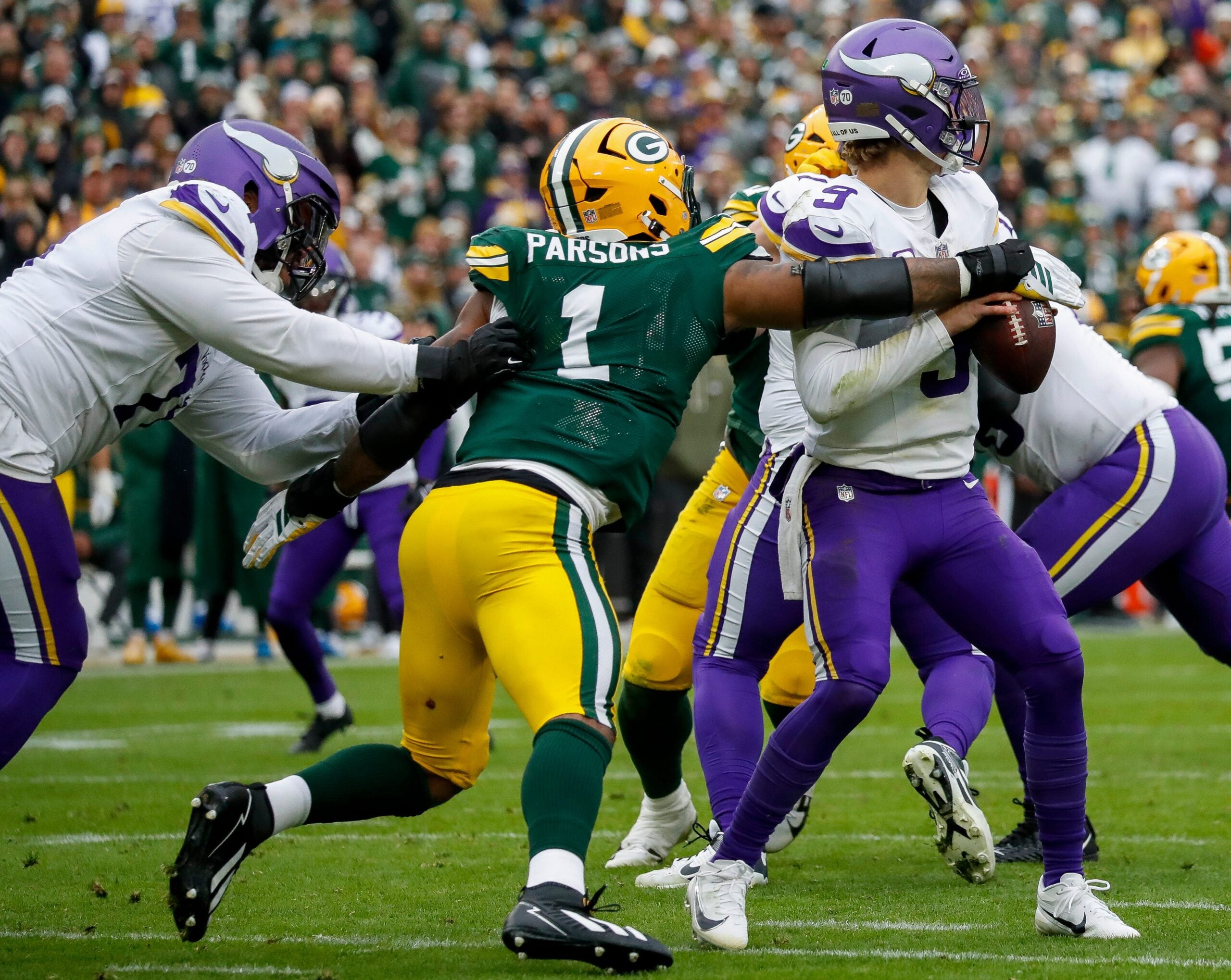 Green Bay Packers defensive end Micah Parsons (1) sacks Minnesota Vikings quarterback J.J. McCarthy (9) on Sunday, November 23, 2025, at Lambeau Field in Green Bay, Wis. The Packers won the game, 23-6.