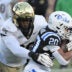 Nov 29, 2025; Durham, North Carolina, USA; Wake Forest Demon Deacons defensive lineman Mateen Ibirogba (99) tackles Duke Blue Devils running back Nate Sheppard (20) during the first quarter at Wallace Wade Stadium.