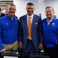 Dec 1, 2025; Gainesville, FL, USA; Florida Gators former head coach Urban Meyer, Florida Gators head coach Jon Sumrall, and Florida Gators former head coach Steve Spurrier pose after the press conference at the Heavener Football Training Center at the University of Florida.