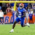 Nov 29, 2025; Gainesville, Florida, USA; Florida Gators running back Jadan Baugh (13) runs with the ball during the third quarter against the Florida State Seminoles at Ben Hill Griffin Stadium.