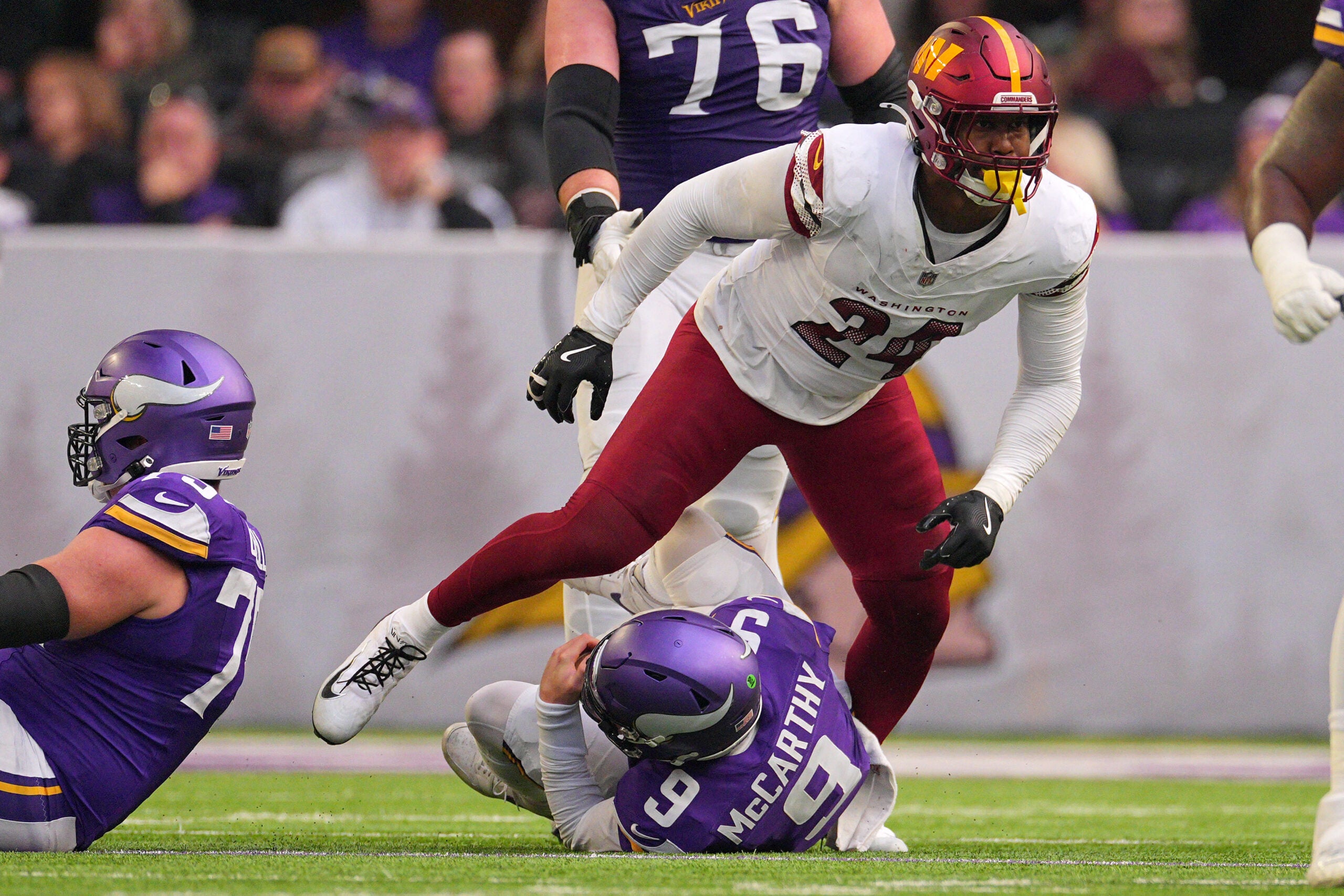 Dec 7, 2025; Minneapolis, Minnesota, USA; Washington Commanders outside linebacker Von Miller (24) sacks Minnesota Vikings quarterback J.J. McCarthy (9) during the first half at U.S. Bank Stadium.