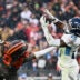 Dec 7, 2025; Cleveland, Ohio, USA; Tennessee Titans safety Xavier Woods (25) intercepts a pass intended for Cleveland Browns wide receiver Gage Larvadain (84) during the third quarter at Huntington Bank Field.