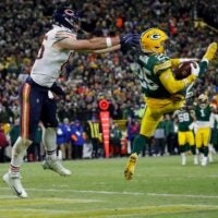 Green Bay Packers cornerback Keisean Nixon (25) intercepts a pass intended for Chicago Bears tight end Cole Kmet (85) in the end zone to seal a victory on Sunday, December 7, 2025, at Lambeau Field in Green Bay, Wis. The Packers won the game, 28-21.