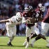 Dec 20, 2025; College Station, TX, USA; Texas A&M Aggies quarterback Marcel Reed (10) scrambles against Miami Hurricanes defensive lineman Akheem Mesidor (3) during the second half of the first round game of the CFP National Playoff at Kyle Field.