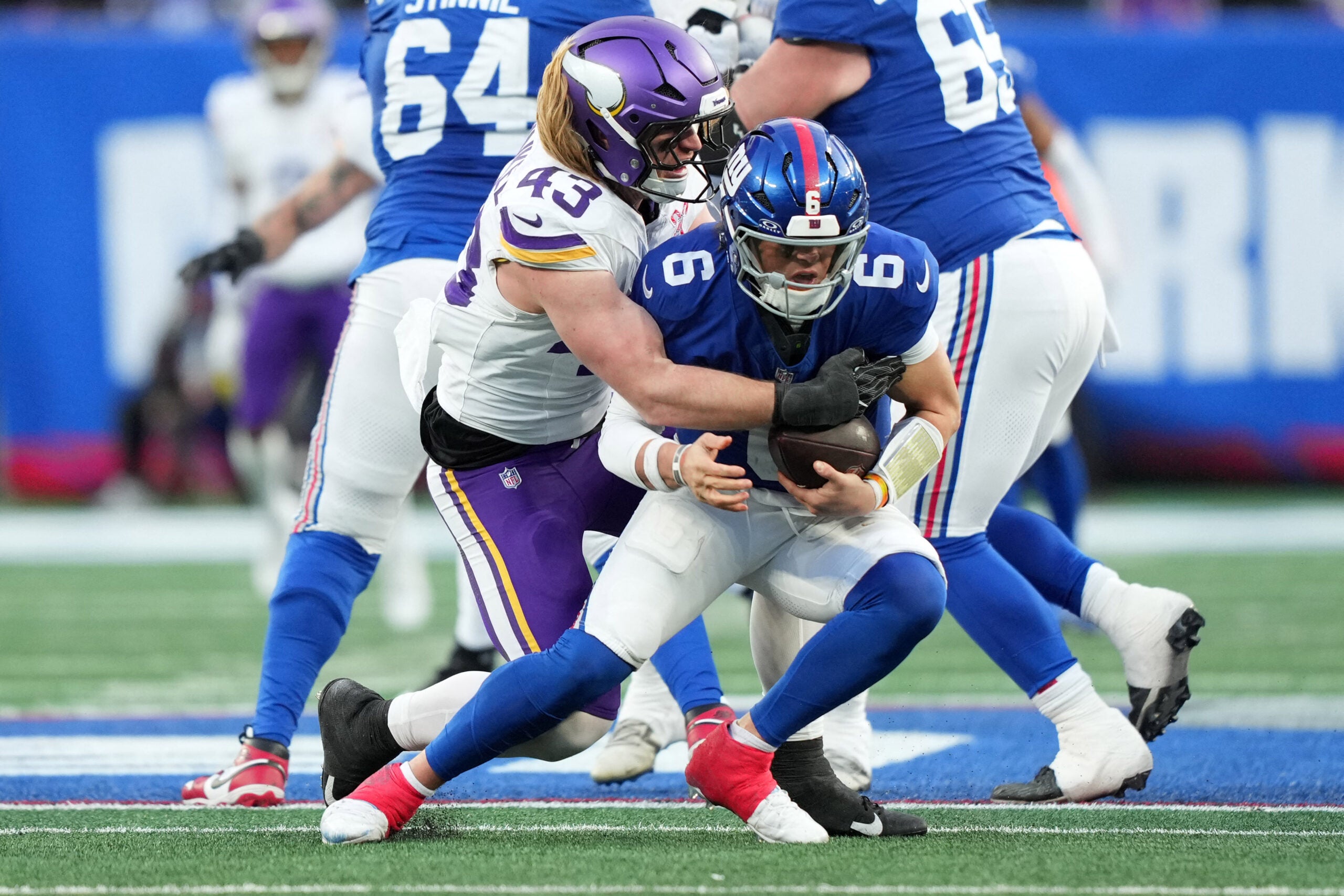 Dec 21, 2025; East Rutherford, New Jersey, USA; Minnesota Vikings outside linebacker Andrew van Ginkel (43) sacks New York Giants quarterback Jaxson Dart (6) during the second half at MetLife Stadium.