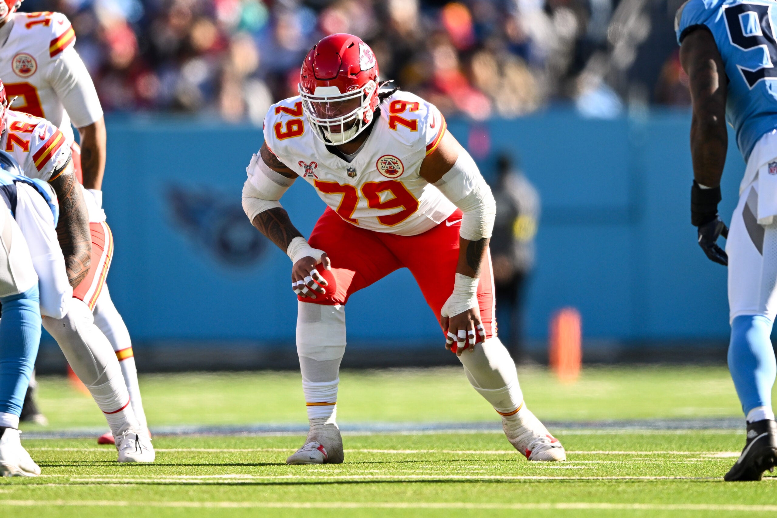 Dec 21, 2025; Nashville, Tennessee, USA; Kansas City Chiefs offensive lineman Esa Pole (79) in stance against the Tennessee Titans during the first half at Nissan Stadium.