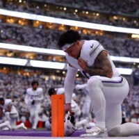 Dec 25, 2025; Minneapolis, Minnesota, USA; Minnesota Vikings linebacker Ivan Pace Jr. (0) kneels in the end zone before the game against the Detroit Lions at U.S. Bank Stadium.