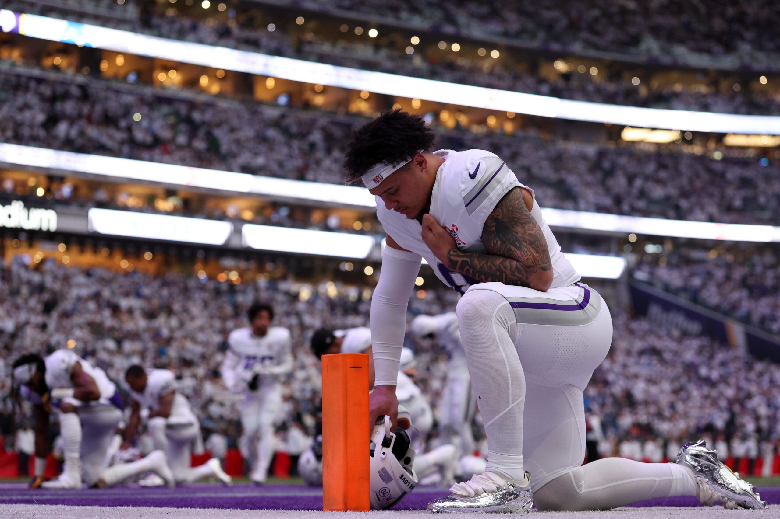 Dec 25, 2025; Minneapolis, Minnesota, USA; Minnesota Vikings linebacker Ivan Pace Jr. (0) kneels in the end zone before the game against the Detroit Lions at U.S. Bank Stadium.