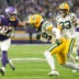 Jan 4, 2026; Minneapolis, Minnesota, USA; Minnesota Vikings running back Jordan Mason (27) runs the ball against Green Bay Packers cornerback Trevon Diggs (28) during the second quarter at U.S. Bank Stadium.