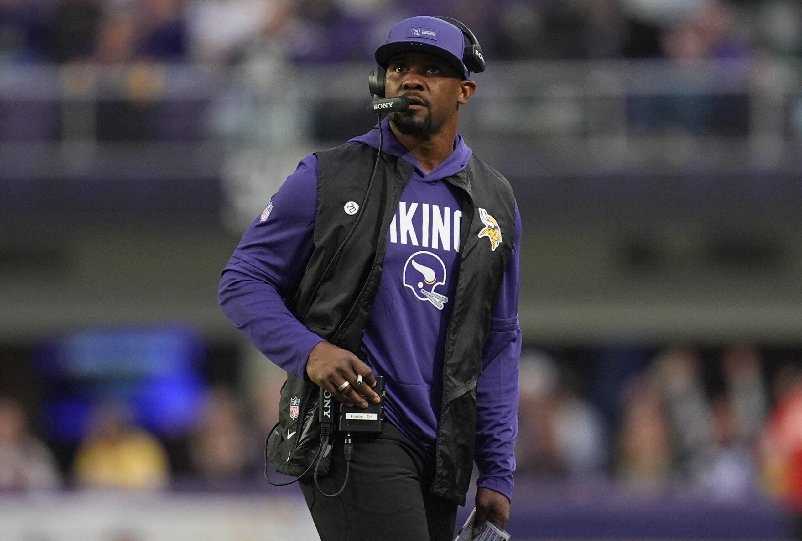 Jan 4, 2026; Minneapolis, Minnesota, USA; Minnesota Vikings defensive coordinator Brian Flores looks on against the Green Bay Packers during the fourth quarter at U.S. Bank Stadium.