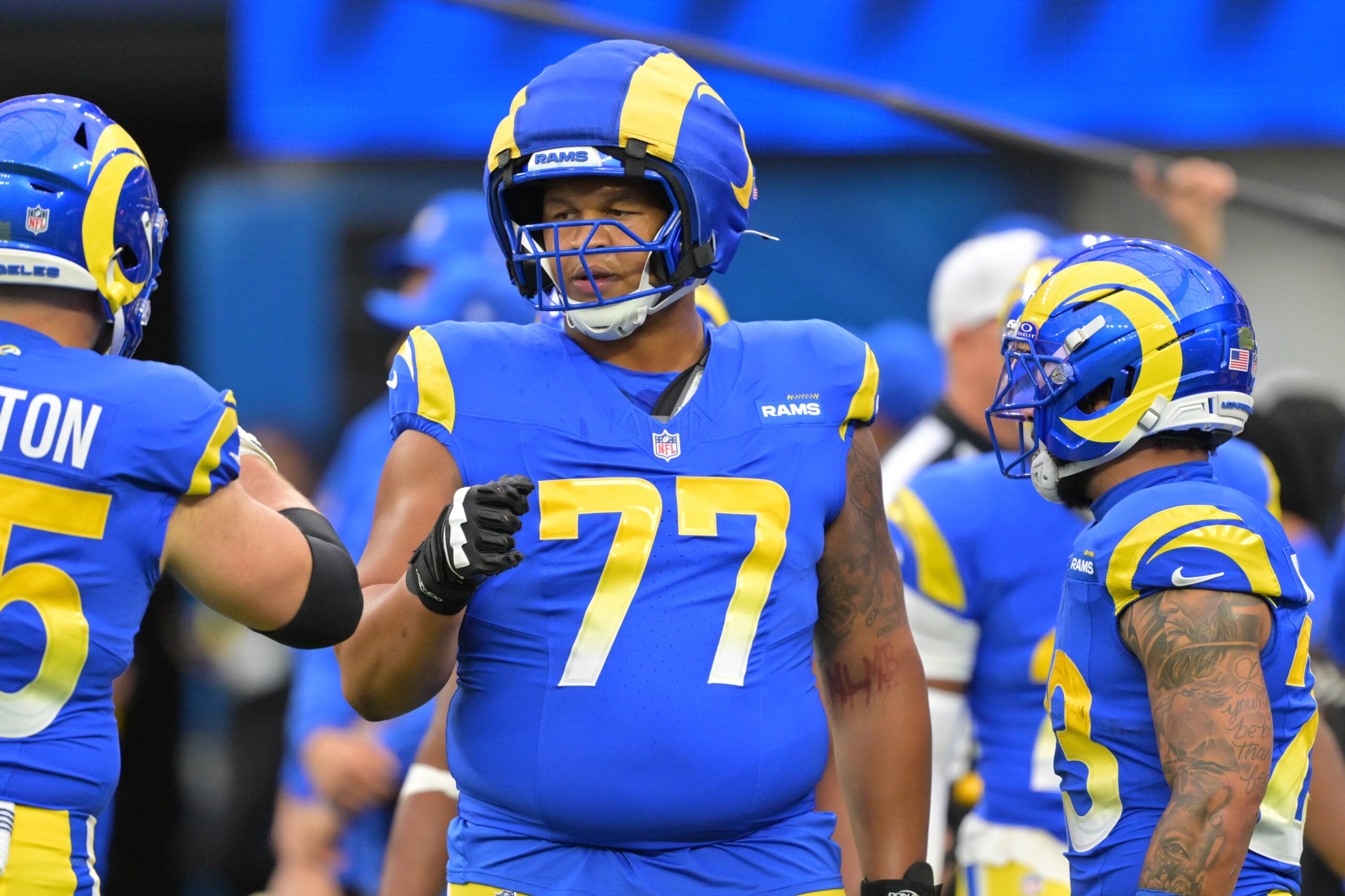 Jan 4, 2026; Inglewood, California, USA; Los Angeles Rams offensive tackle Alaric Jackson (77) on the field prior to a game against the Arizona Cardinals at SoFi Stadium.