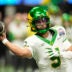 Jan 9, 2026; Atlanta, GA, USA; Oregon Ducks quarterback Dante Moore (5) throws a pass during the fourth quarter the 2025 Peach Bowl and semifinal game of the College Football Playoff at Mercedes-Benz Stadium.