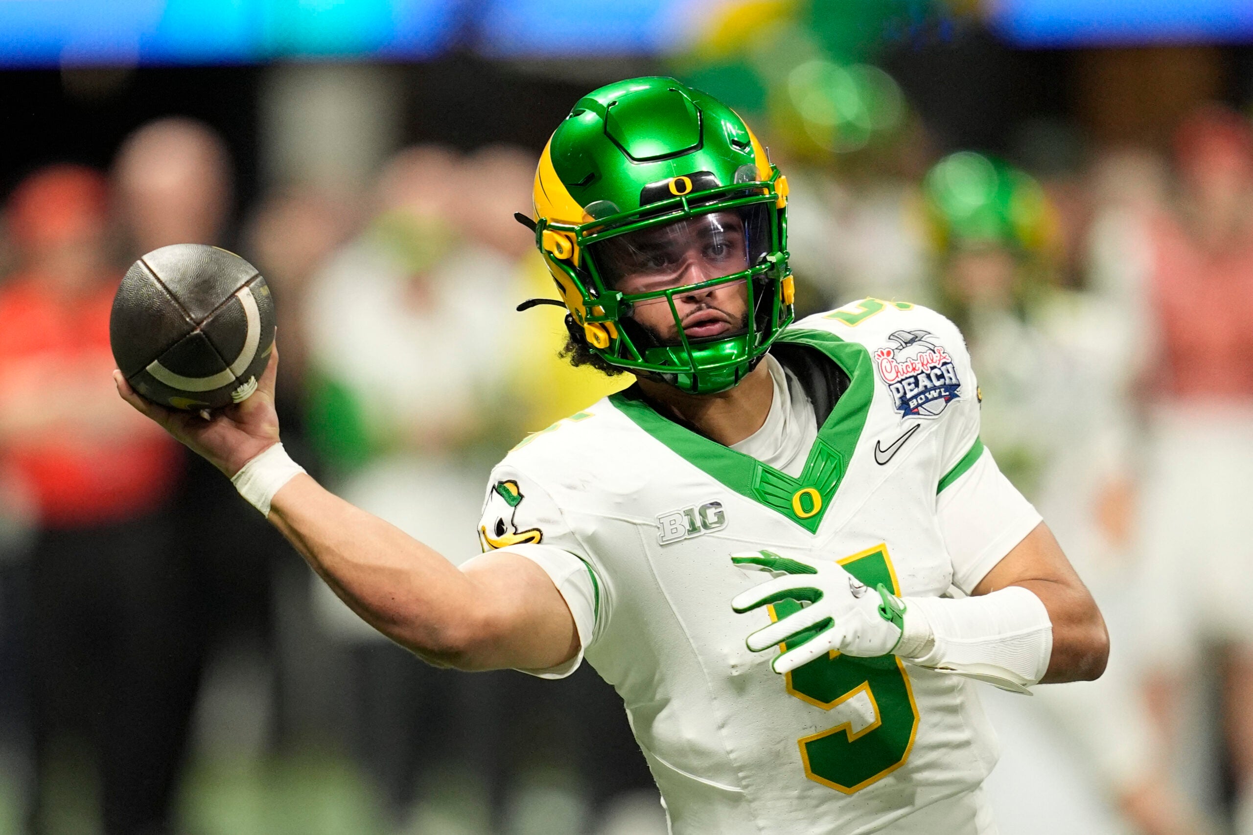 Jan 9, 2026; Atlanta, GA, USA; Oregon Ducks quarterback Dante Moore (5) throws a pass during the fourth quarter the 2025 Peach Bowl and semifinal game of the College Football Playoff at Mercedes-Benz Stadium.