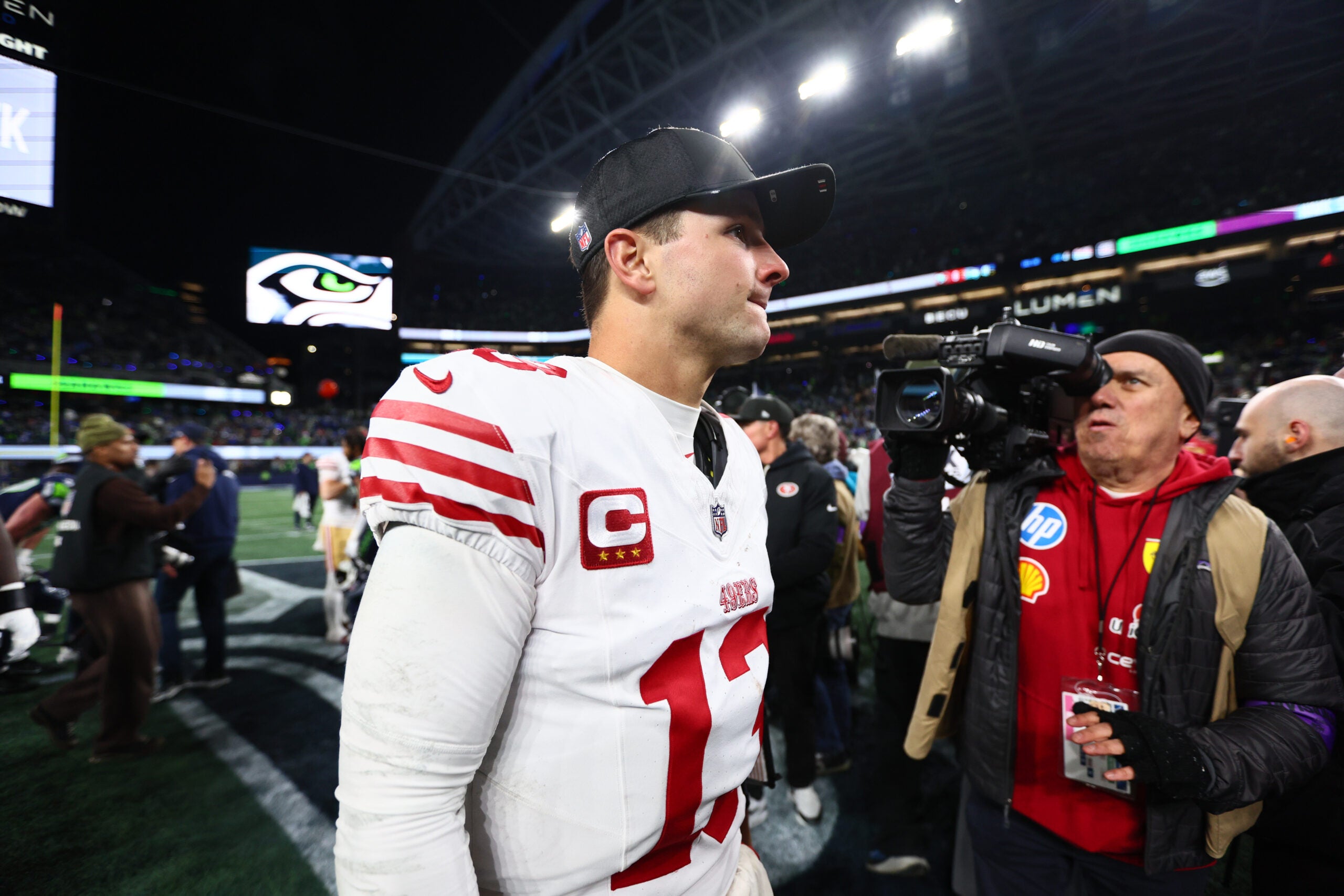 Jan 17, 2026; Seattle, WA, USA; San Francisco 49ers quarterback Brock Purdy (13) leaves the field following an NFC Divisional Round game against the Seattle Seahawks at Lumen Field.