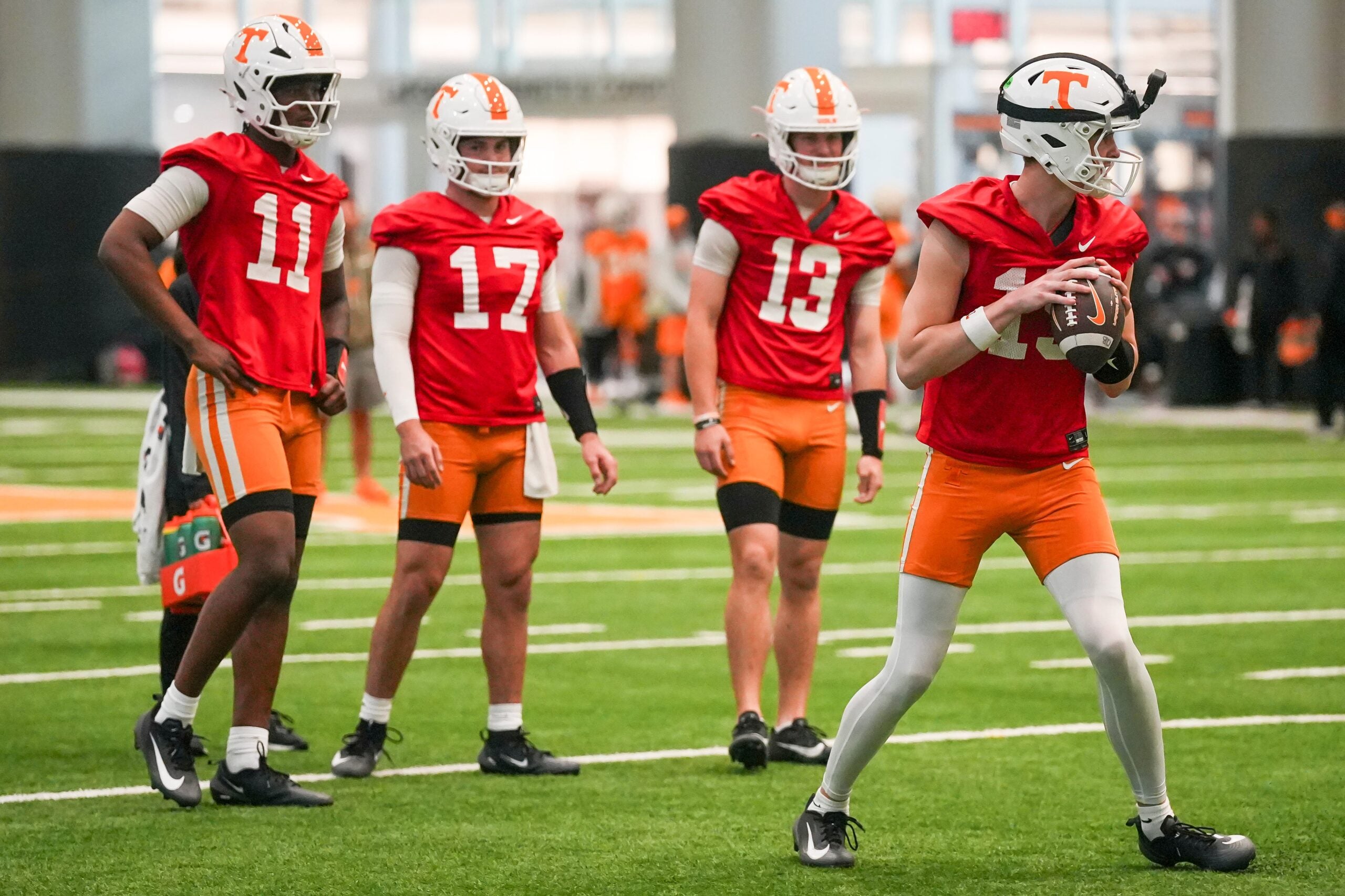 Tennessee quarterbacks, from left, Faizon Brandon (11), Ryan Staub (17), Mason Phillips (13) and George MacIntyre (15) during the Vols' first spring football practice in Knoxville on March 16, 2026.