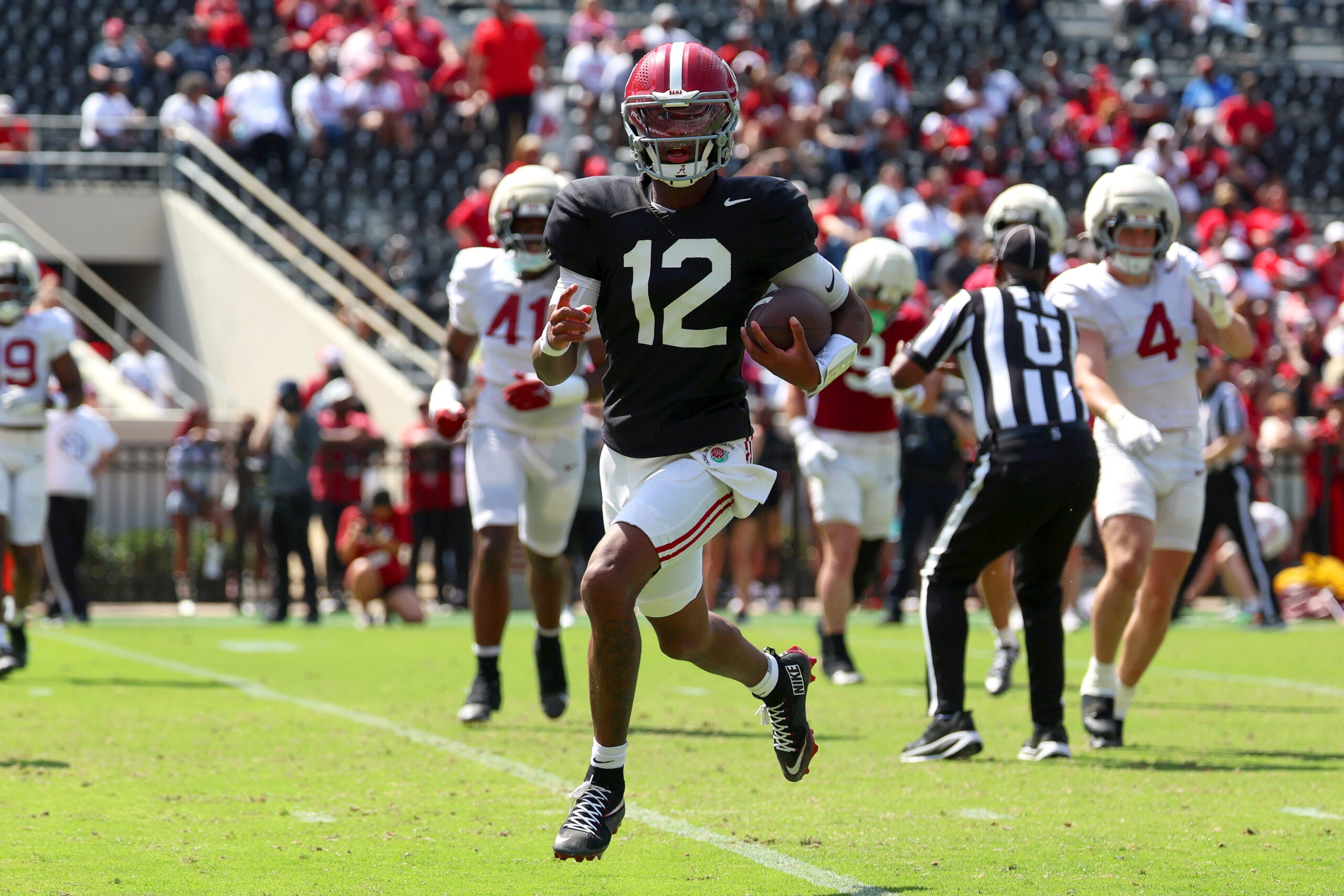 Apr 11, 2026; Tuscaloosa, AL, USA; Alabama Crimson Tide quarterback Keelon Russell (12) runs the ball during the Alabama A-Day spring football scrimmage game at Saban Field at Bryant-Denny Stadium.