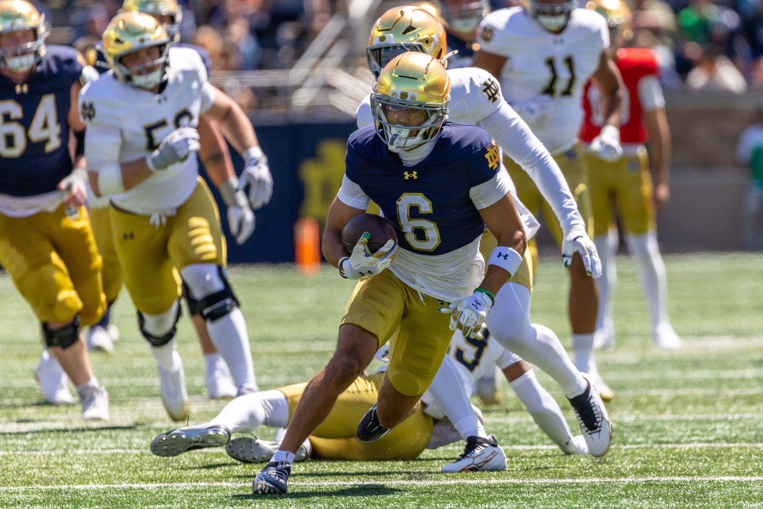 Apr 25, 2026; Notre Dame, IN, USA; Notre Dame Fighting Irish wide receiver Jordan Faison (6) runs with the ball during the Blue-Gold game at Notre Dame Stadium.