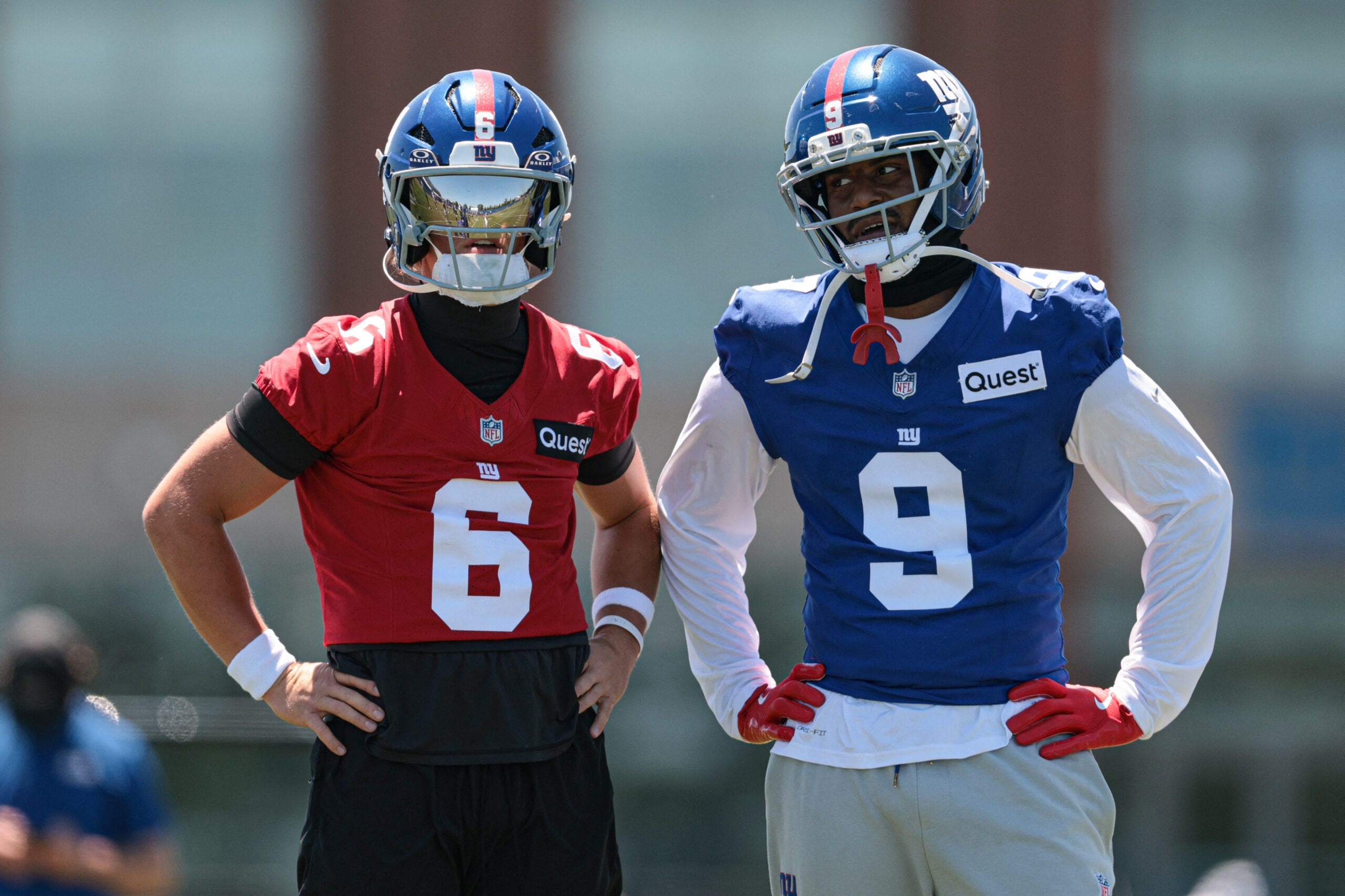 Jun 3, 2026; East Rutherford, NJ, USA; New York Giants quarterback Jaxson Dart (6) and wide receiver Isaiah Likely (9) talk during organized team activities at Quest Diagnostics Training Center.