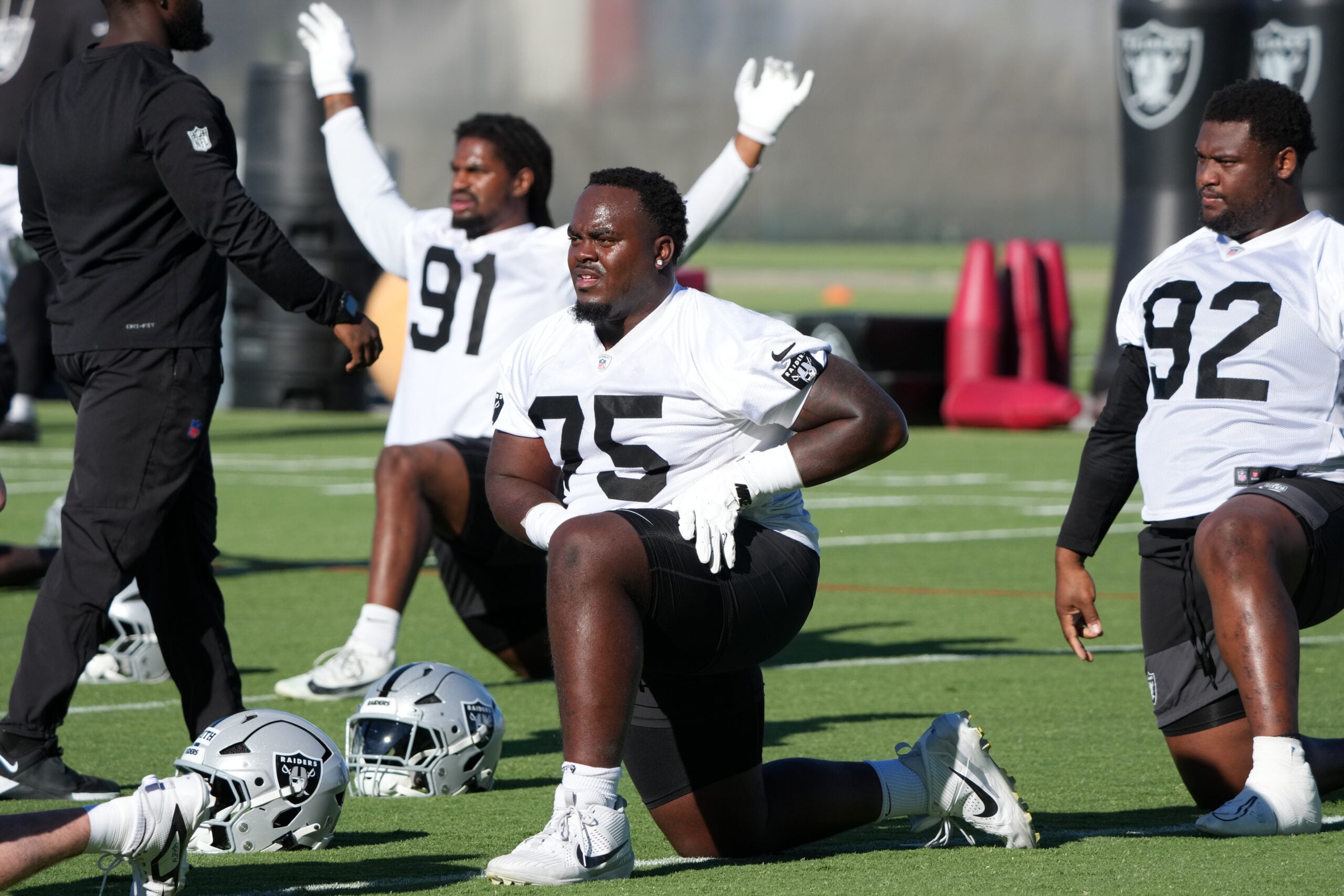 Jun 9, 2026; Henderson, NV, USA; Las Vegas Raiders defensive tackle Gary Smith III (75) stretches during minicamp at Intermountain Health Performance Center.