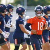 Jul 29, 2026; Lake Forest, IL, USA; Chicago Bears quarterback Caleb Williams (18) runs on the field during Training Camp at Halas Hall.