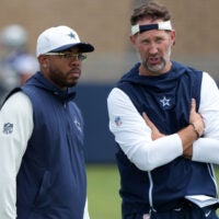 Jul 29, 2026; Oxnard, CA, USA; Dallas Cowboys defensive coordinator Christian Parker (left) with head coach Brian Schottenheimer at training camp at River Ridge Playing Fields.