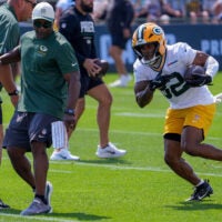 Green Bay Packers running back MarShawn Lloyd (32) runs through a drill during the second day of training camp Thursday, July 30, 2026, at the Don Hutson Center in Ashwaubenon, Wisconsin.