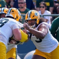 Green Bay Packers offensive linemen Dalton Cooper (78) and John Williams (73) run through a drill during the second day of training camp Thursday, July 30, 2026, at the Don Hutson Center in Ashwaubenon, Wisconsin.