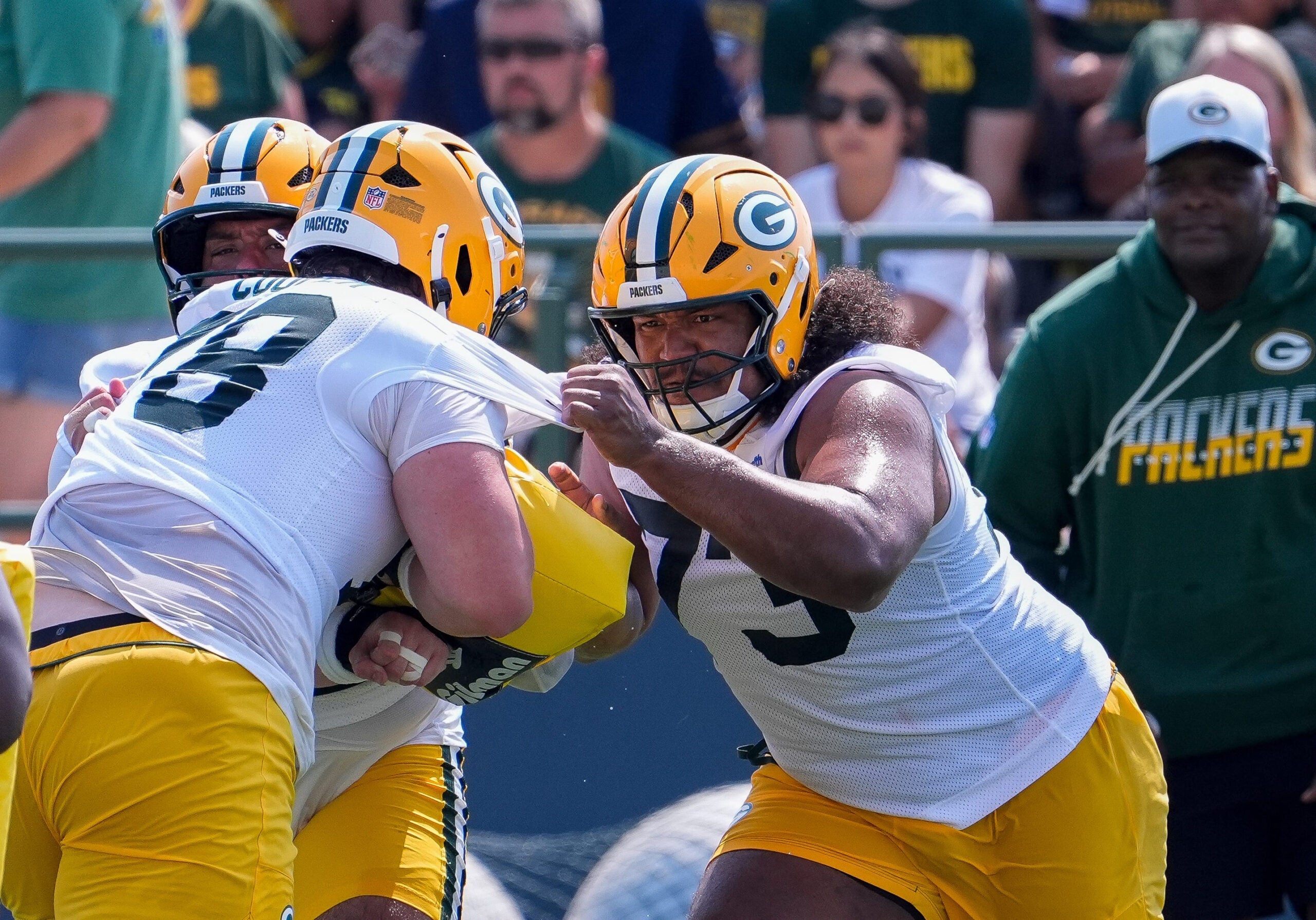 Green Bay Packers offensive linemen Dalton Cooper (78) and John Williams (73) run through a drill during the second day of training camp Thursday, July 30, 2026, at the Don Hutson Center in Ashwaubenon, Wisconsin.