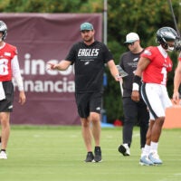 Jul 30, 2026; Philadelphia, PA, USA; Philadelphia Eagles offensive coordinator Sean Mannion and quarterbacks Jalen Hurts (1) and Andy Dalton (14) and Cole Payton (10) and Tanner McKee (16) during training camp at Jefferson Health Training Complex.