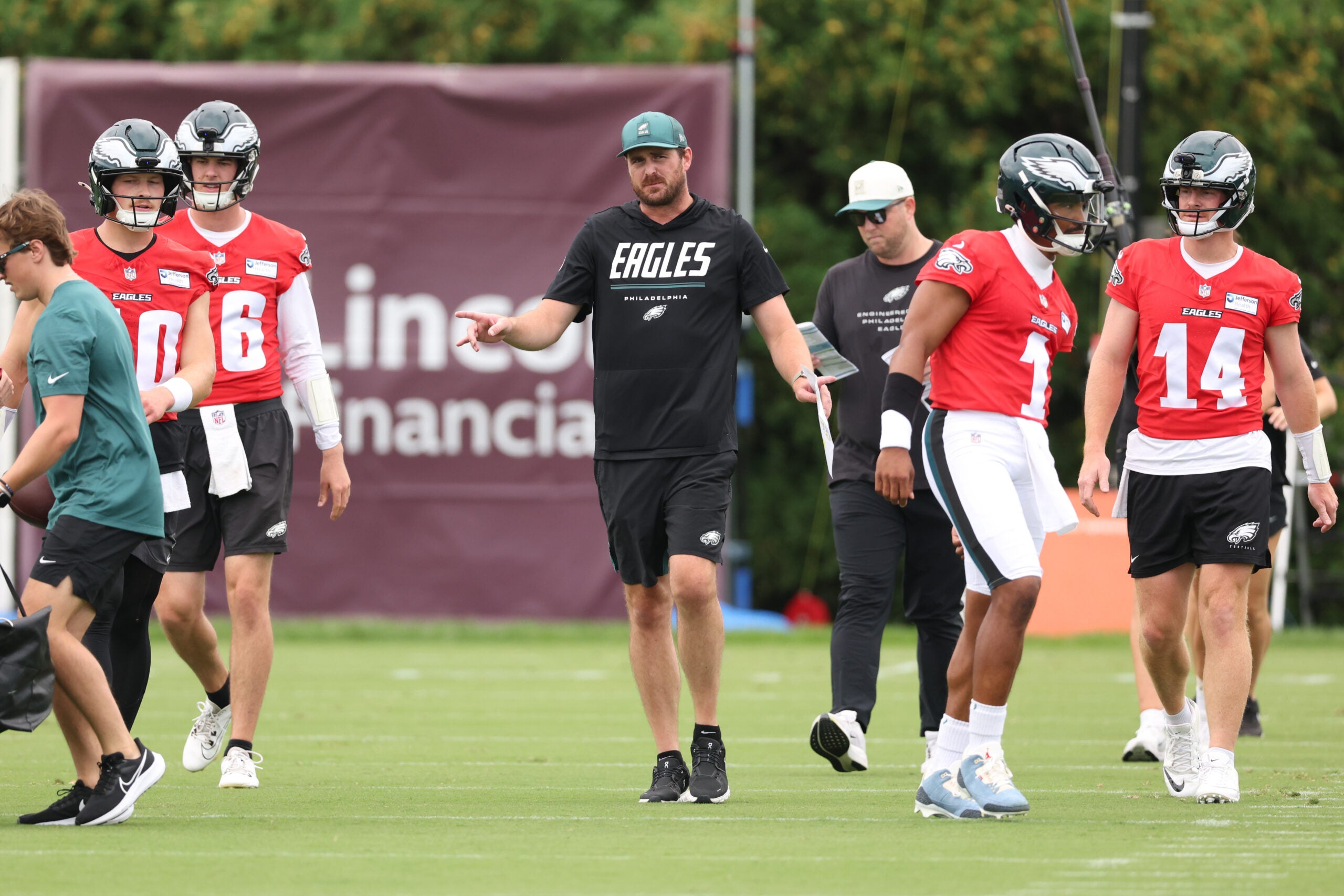 Jul 30, 2026; Philadelphia, PA, USA; Philadelphia Eagles offensive coordinator Sean Mannion and quarterbacks Jalen Hurts (1) and Andy Dalton (14) and Cole Payton (10) and Tanner McKee (16) during training camp at Jefferson Health Training Complex.