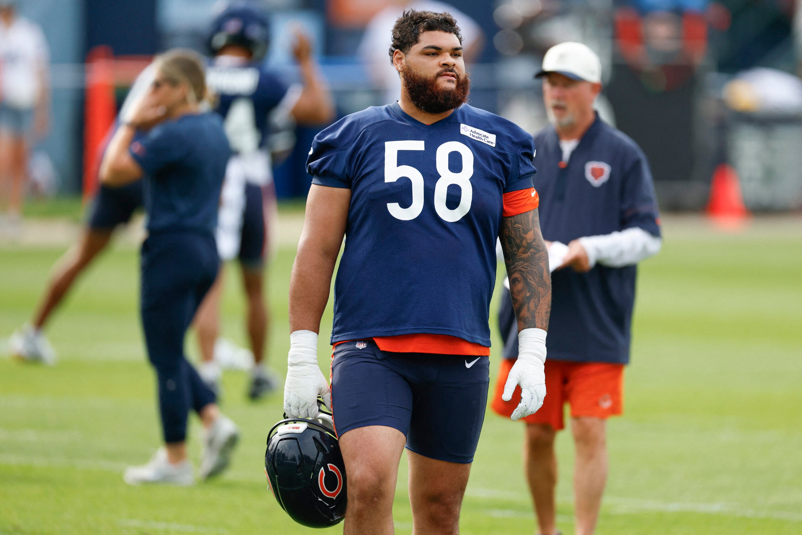 Jul 31, 2026; Lake Forest, IL, USA; Chicago Bears offensive tackle Darnell Wright (58) walks on he field during Training Camp at Halas Hall.