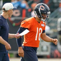 Jul 31, 2026; Lake Forest, IL, USA; Chicago Bears head coach Ben Johnson talks to quarterback Caleb Williams (18) during Training Camp at Halas Hall.