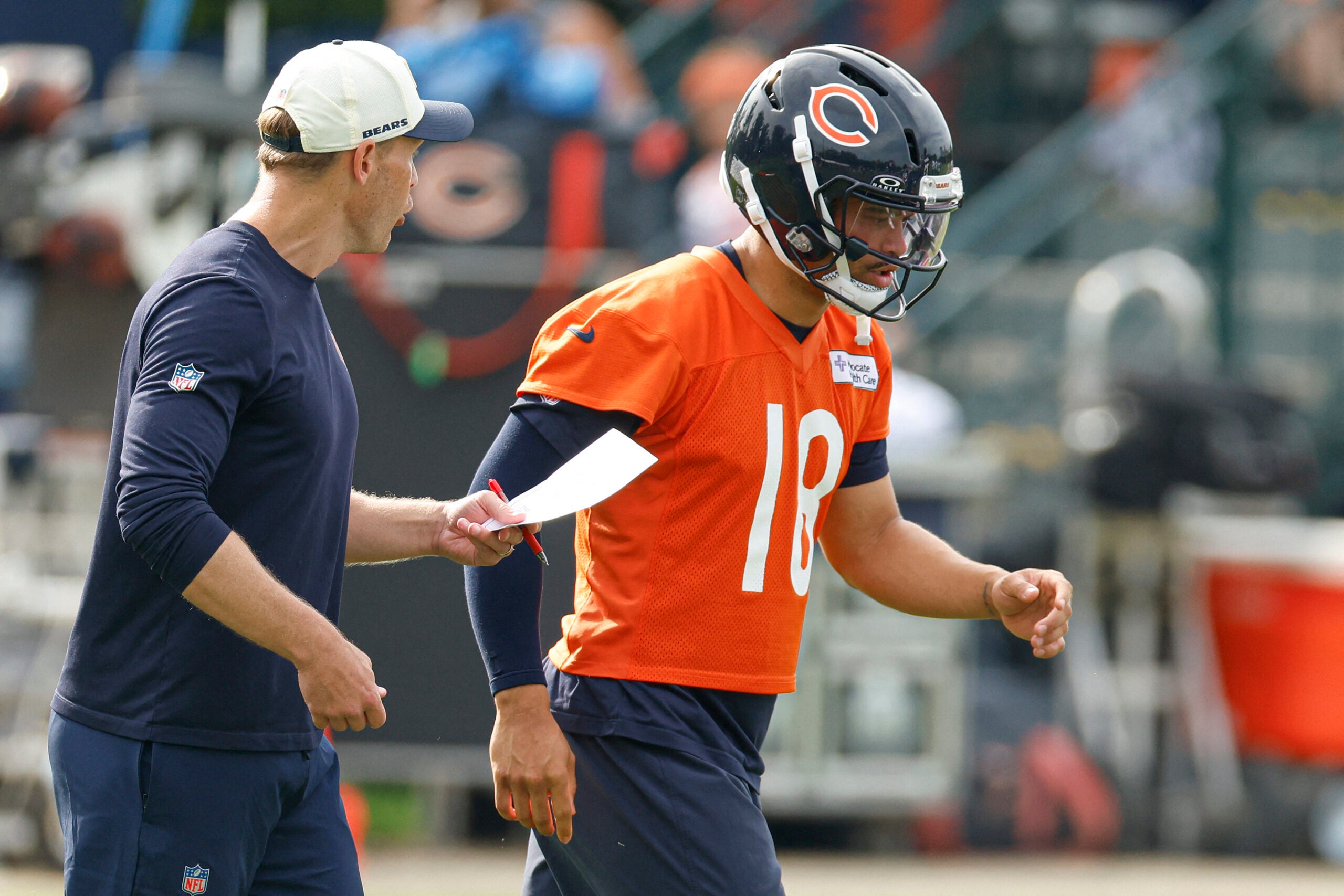 Jul 31, 2026; Lake Forest, IL, USA; Chicago Bears head coach Ben Johnson talks to quarterback Caleb Williams (18) during Training Camp at Halas Hall.
